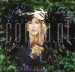 24-06-2001 Patricia Paay at home in Rijkevorsel, Belgium. By order of Beaumonde Magazine. May 24, 2001.

[keywords]Posed, Half Length, Eyecontact, Feathers[/keywords]